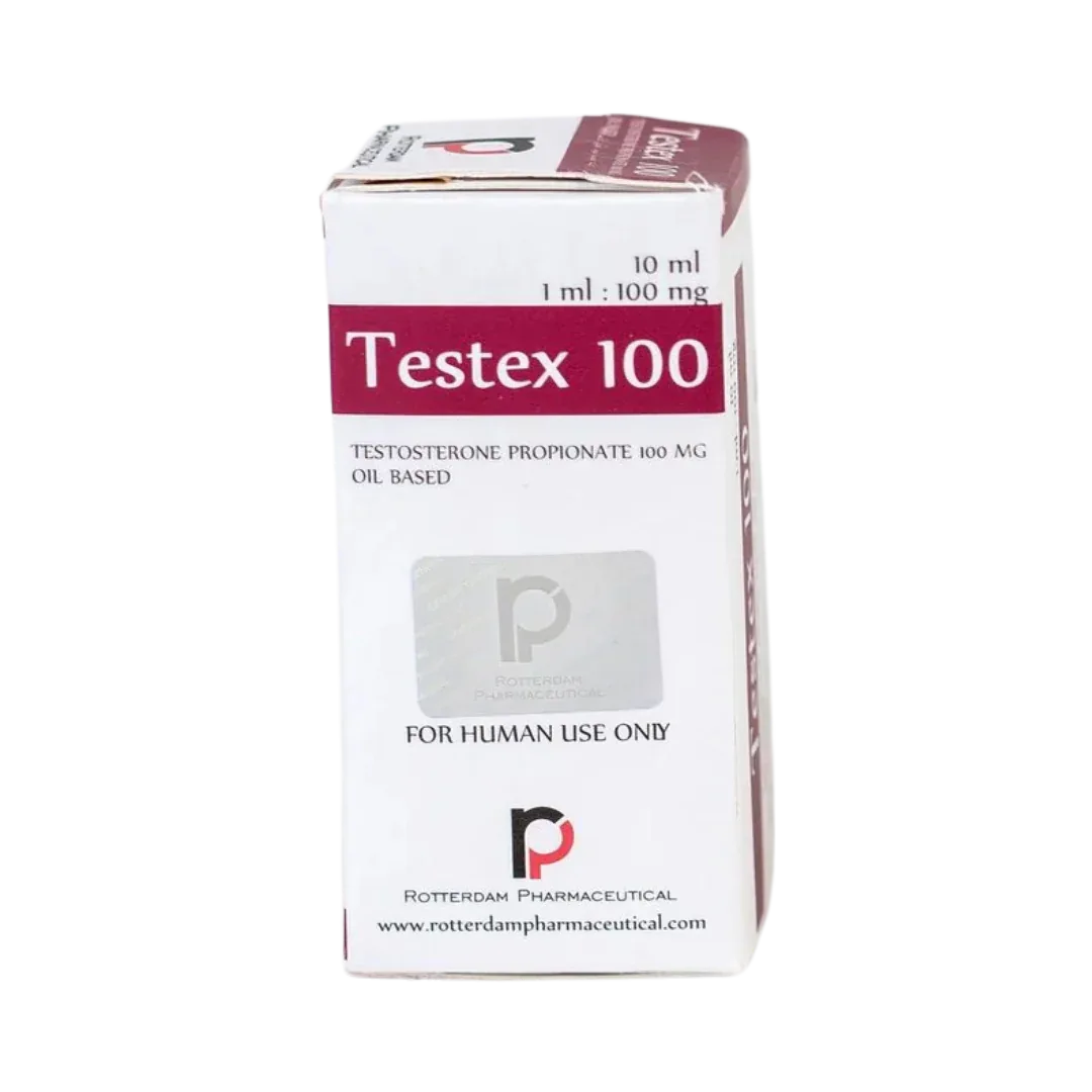 Una caja blanca con la etiqueta Testex 100 - ROTTERDAM con detalles en color granate contiene un vial de 10 ml de propionato de testosterona, base de aceite. Dice SOLO PARA USO HUMANO y 1 ml: 100 mg. El logotipo y el sello de Rotterdam Pharmaceutical se muestran de forma destacada en la parte inferior. Marca: Get Fit México.