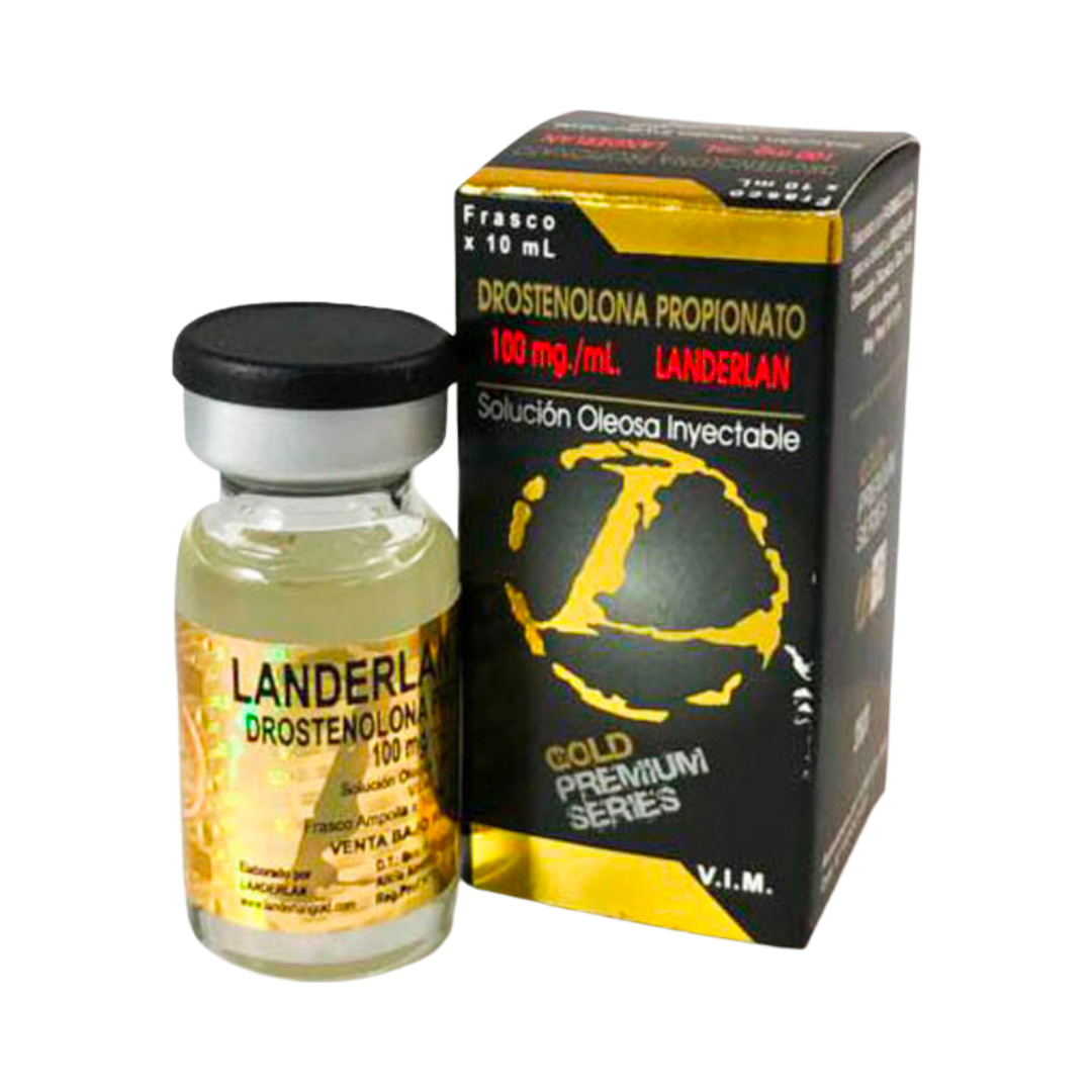 Un vial de líquido amarillo marcado Get Fit Mexico Masteron - LANDERLAN 100 mg/mL se encuentra al lado de una caja negra/amarilla con un mapa del mundo y la etiqueta Gold Premium Series, que indica que es Drostenolona Propionato 100 mg/mL Landerlan Solución Oleosa Inyectable 10 mL.